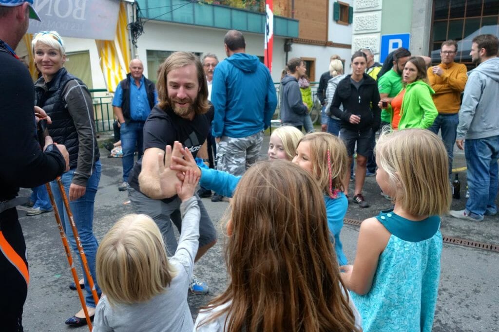 Tinder greets a few of his younger Swiss fans after his race in Champéry, Switzerland.