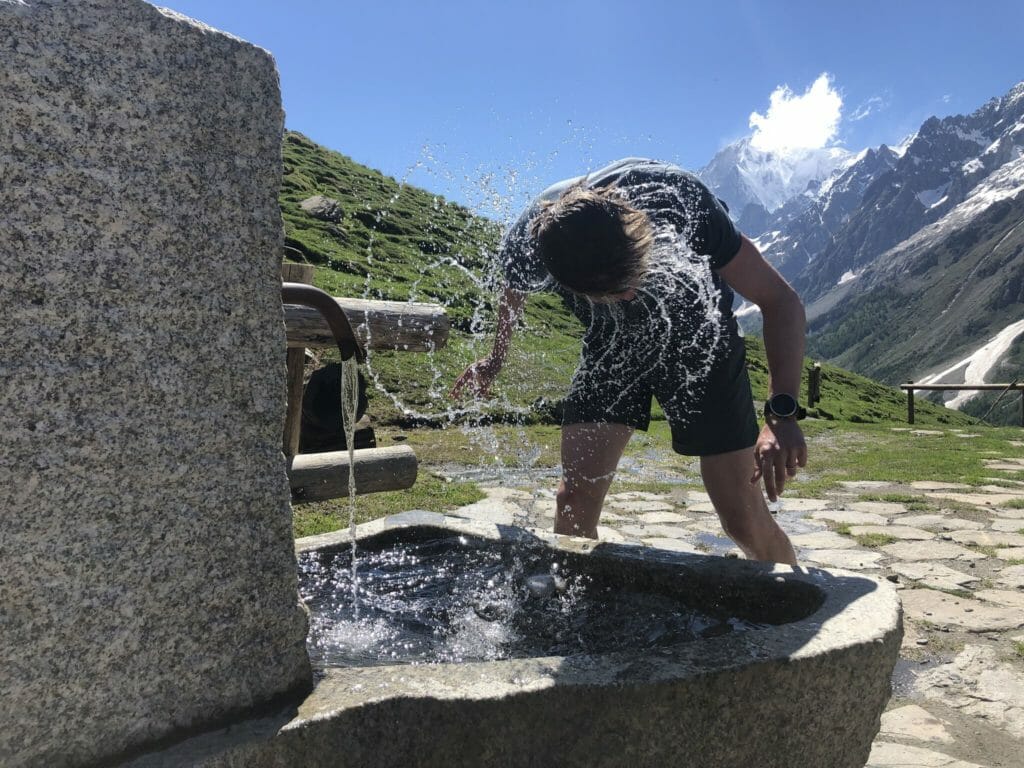 Max dunking his head in a Bonatti spring. (Photo: Doug Mayer)