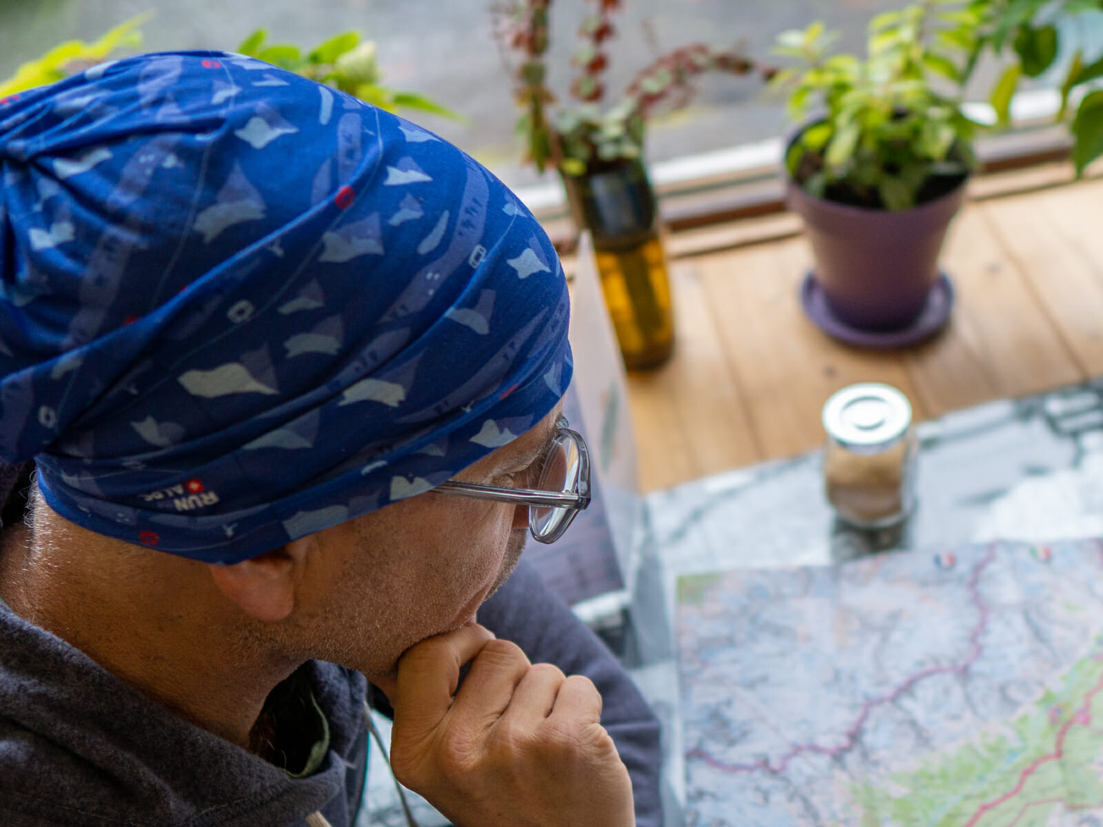 Doug with Run the Alps buff looking at a map