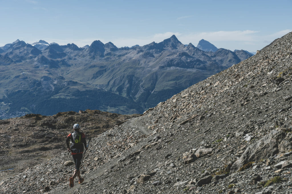 Trail runner running down towards Pontresina