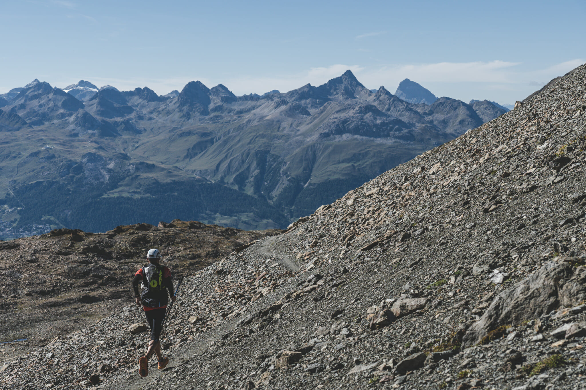 Trail runner running down towards Pontresina