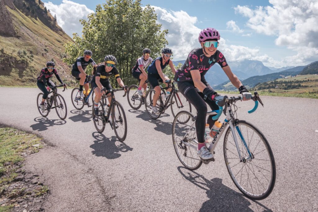 a group of cyclists in the alps