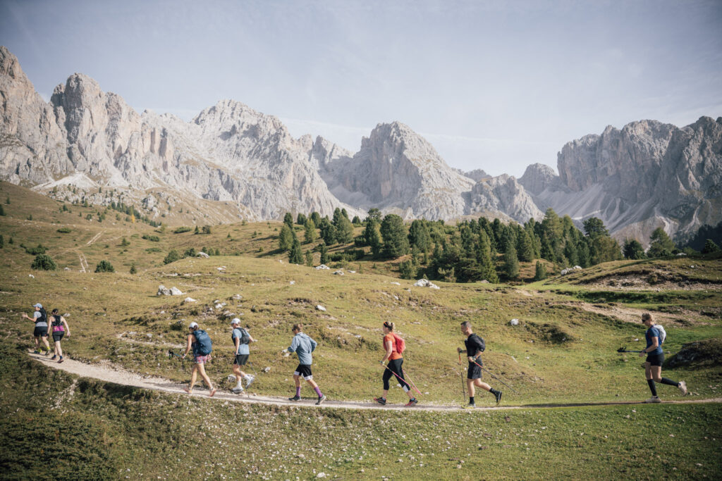 runners on a trail in the Dolomites